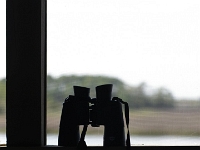 29290Re - Vacation at Kiawah Island, SC - Binoculars on the porch  Peter Rhebergen - Each New Day a Miracle